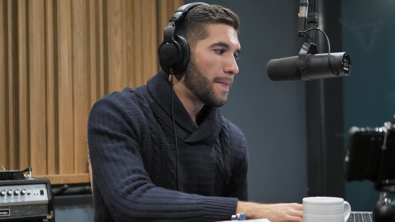 Stock Video Man Speaking Into The Microphone At Record Studi Animated Wallpaper