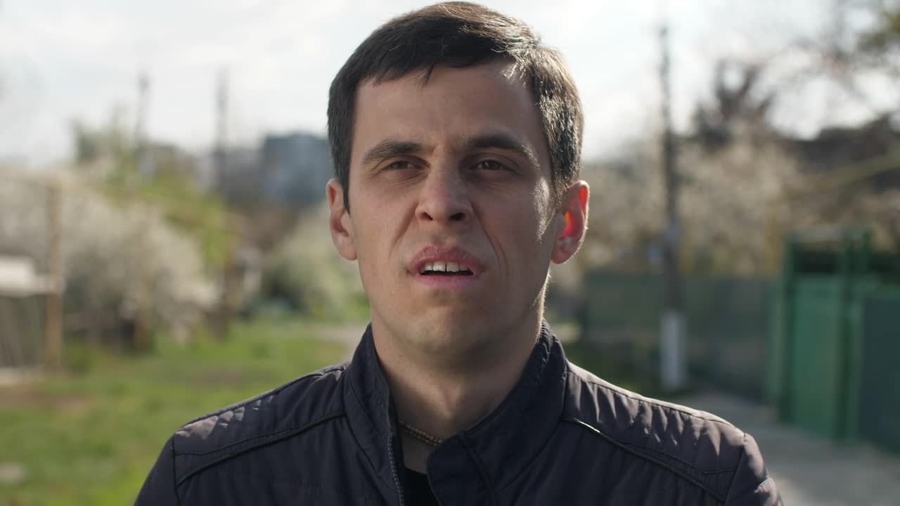 Stock Video Man Sneezing Outdoor Animated Wallpaper