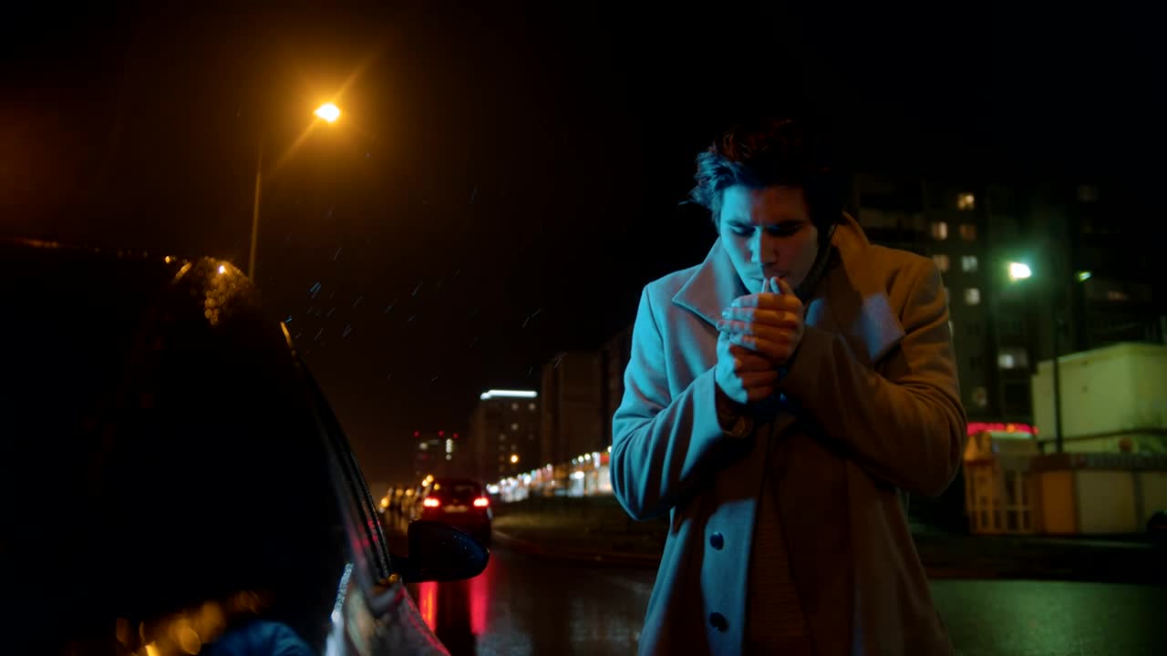 Stock Video Man Smoking Out Of His Car At Nigh Animated Wallpaper