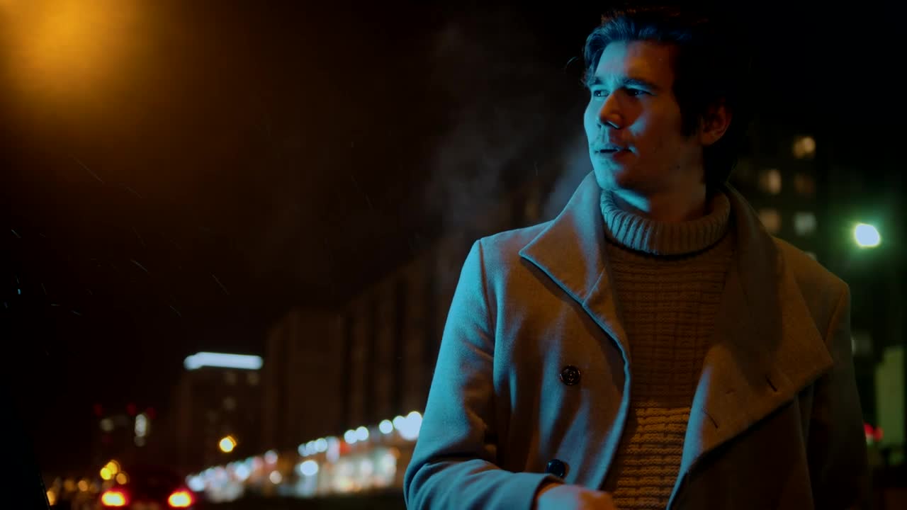 Stock Video Man Smoking In The Street On A Light Rainy Nigh Animated Wallpaper