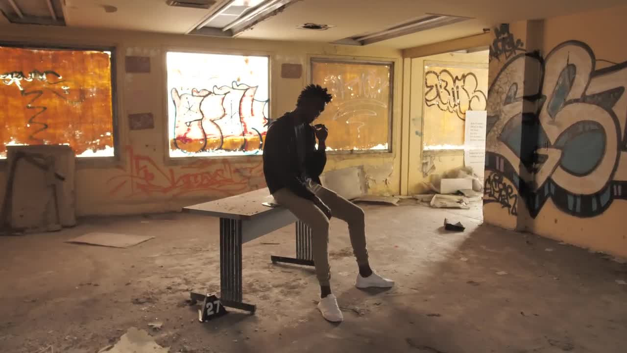Stock Video Man Smoking In An Abandoned Buildin Animated Wallpaper