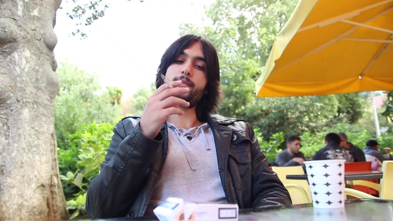 Stock Video Man Smoking And Drinking Coffee Outdoor Sho Animated Wallpaper
