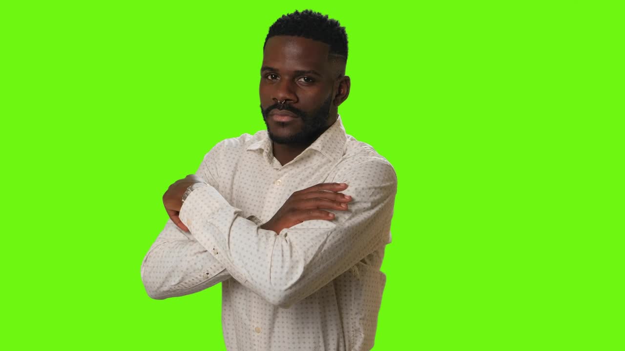Stock Video Man Smiling With Arms Crossed On A Green Backgroun Animated Wallpaper