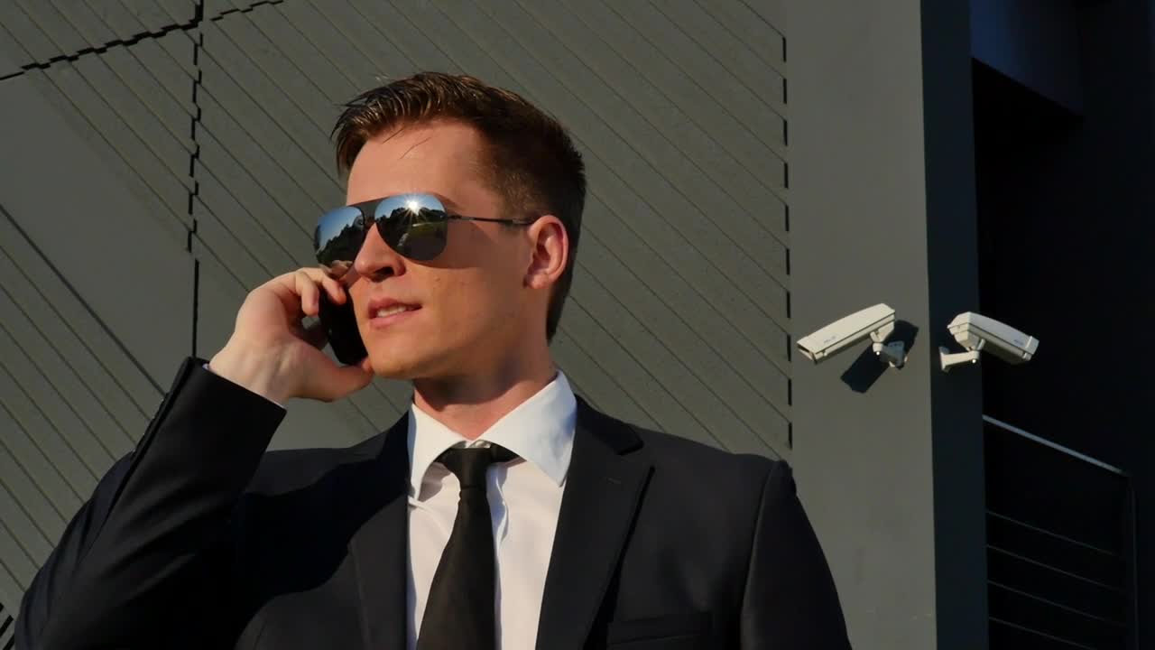 Stock Video Man Smiling On The Phon Animated Wallpaper