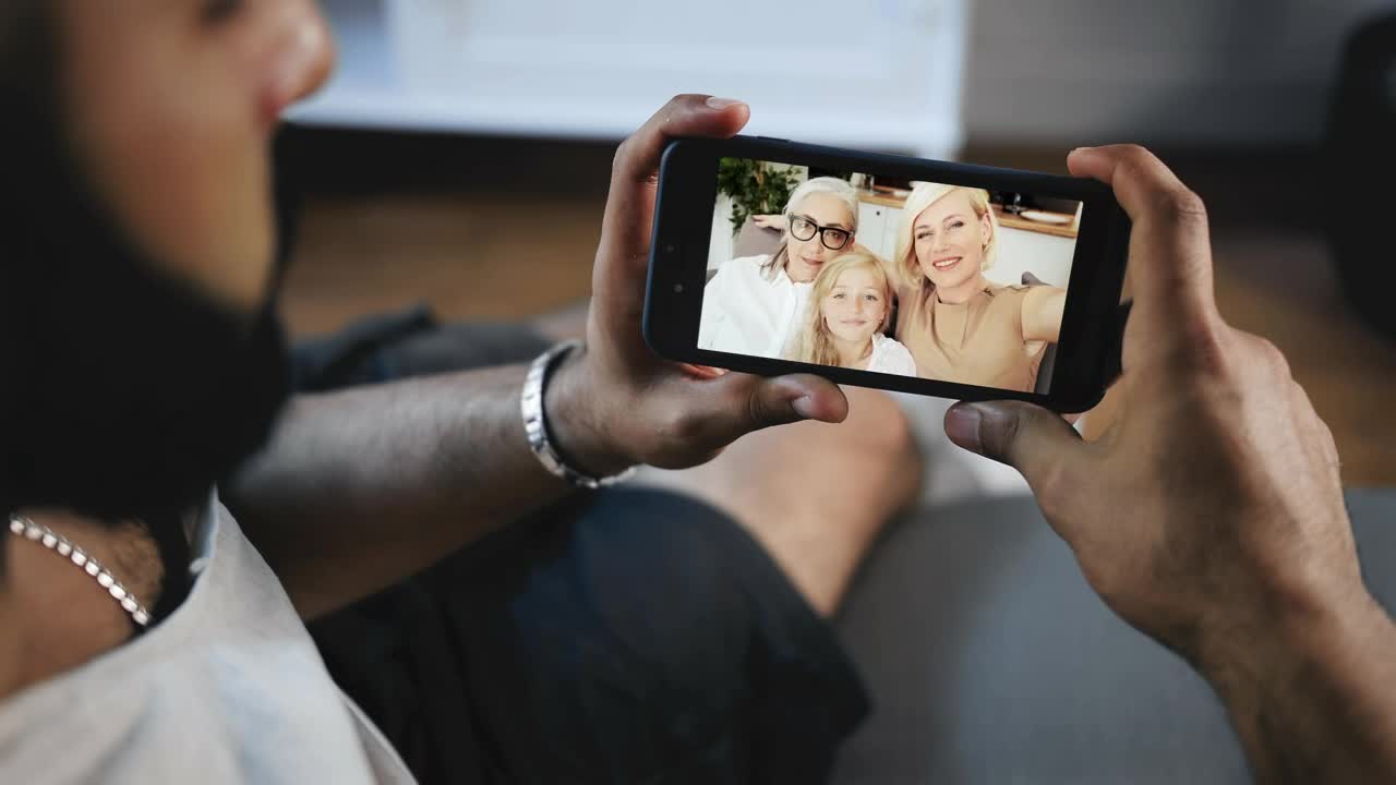 Stock Video Man Smiles At Facebook Video Call From Famil Animated Wallpaper