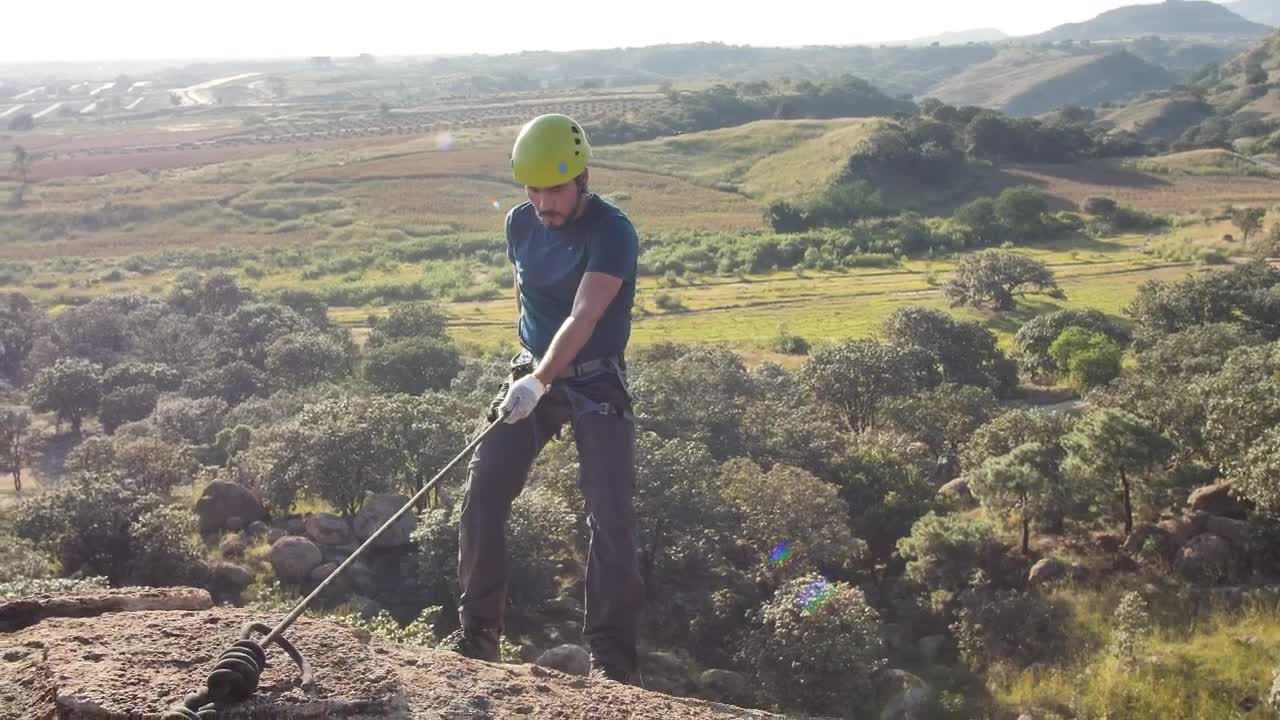 Stock Video Man Slowly Coming Down From The Top Of A Hil Animated Wallpaper