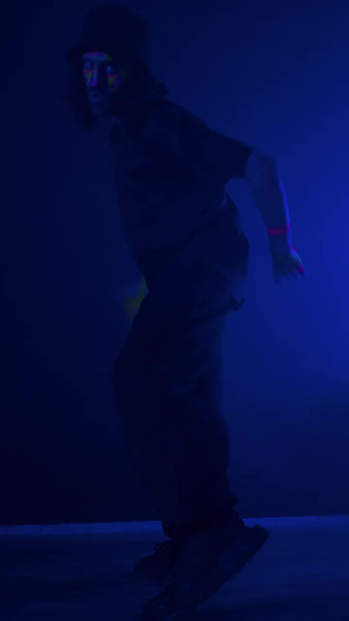 Stock Video Man Skillfully Dancing In The Dar Animated Wallpaper