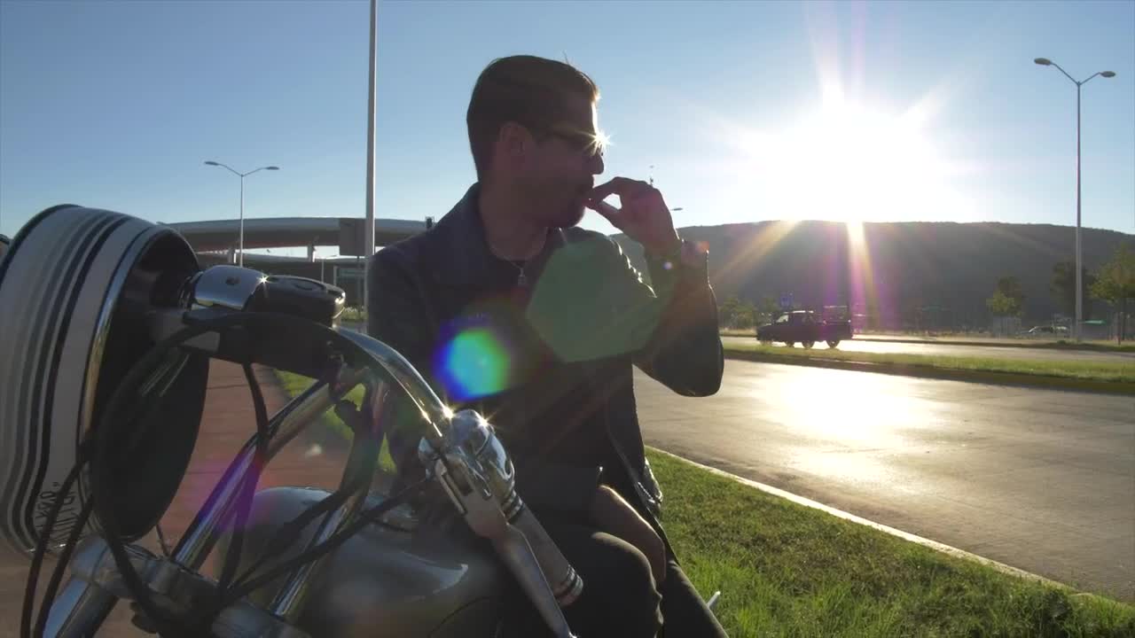 Stock Video Man Sitting On His Motorcycl Animated Wallpaper
