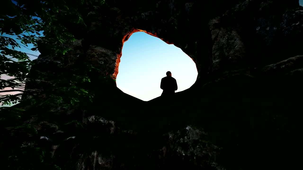 Stock Video Man Sitting On A Rocky Formations In Natur Animated Wallpaper