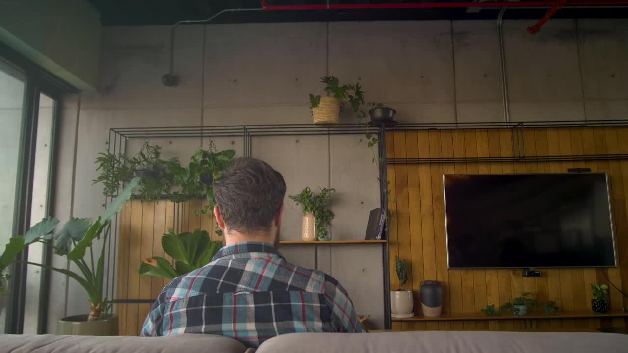 Stock Video Man Sitting On A Couch Uses Virtual Reality Glasse Animated Wallpaper