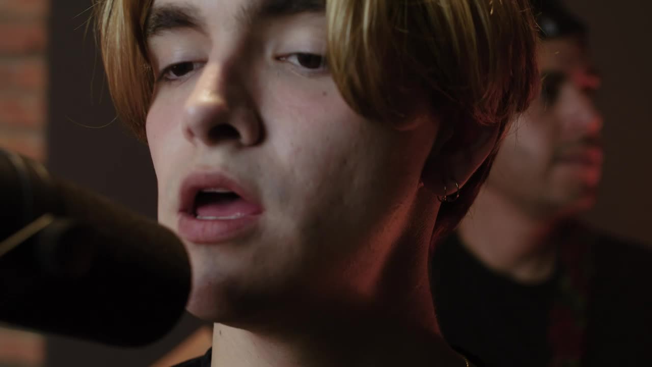 Stock Video Man Singing In Front Of A Studio Microphon Animated Wallpaper