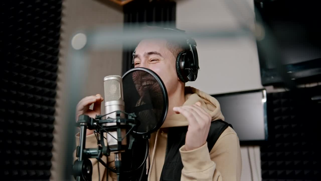 Stock Video Man Singing Into A Microphone In An Audio Boot Animated Wallpaper