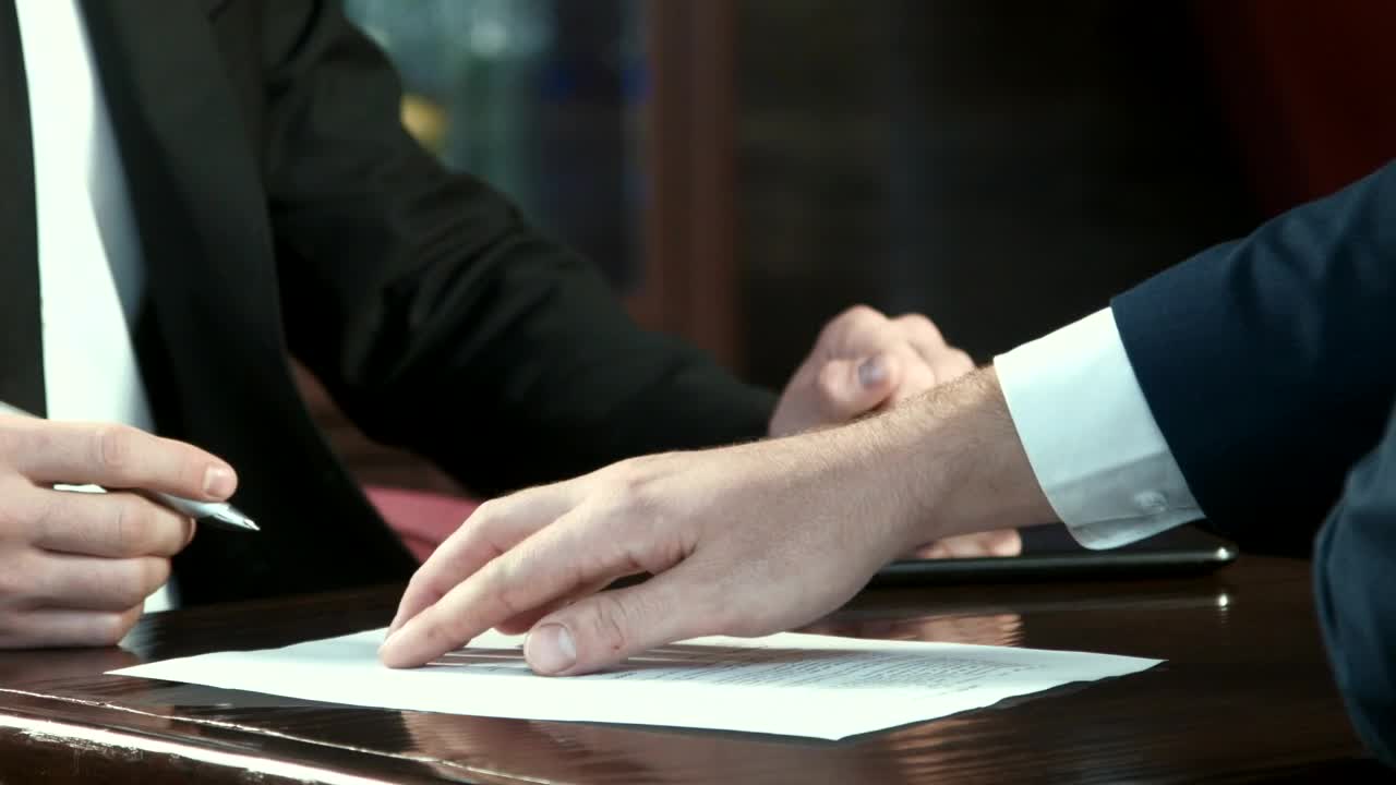 Stock Video Man Signing Off A Contract And Handshak Animated Wallpaper