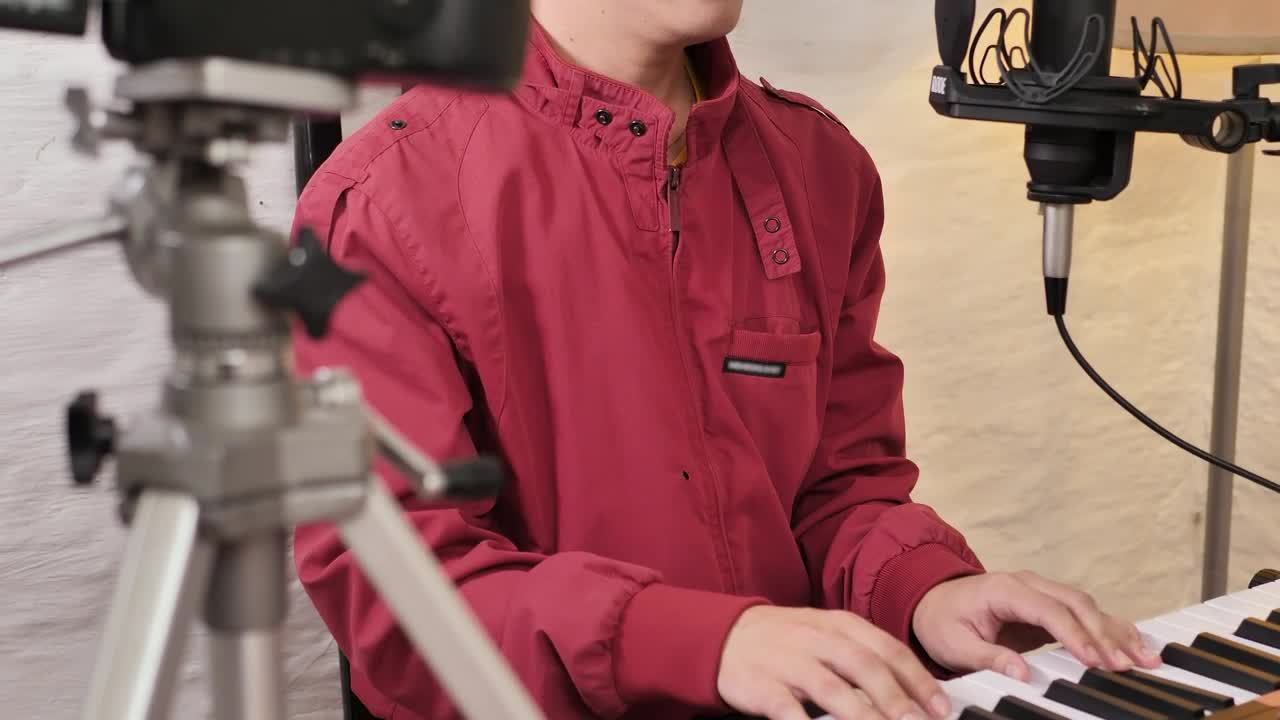 Stock Video Man Shooting A Video Singing And Playing The Pian Animated Wallpaper