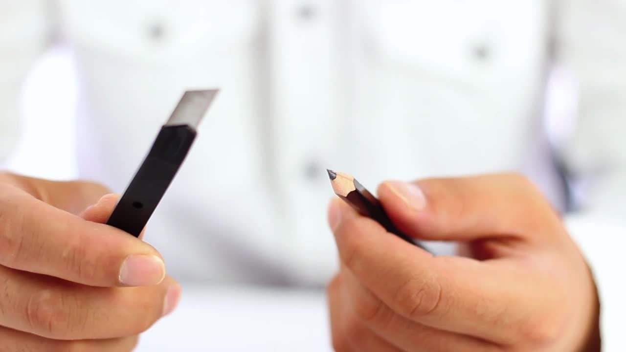 Stock Video Man Sharpening A Pencil With A Cutte Animated Wallpaper
