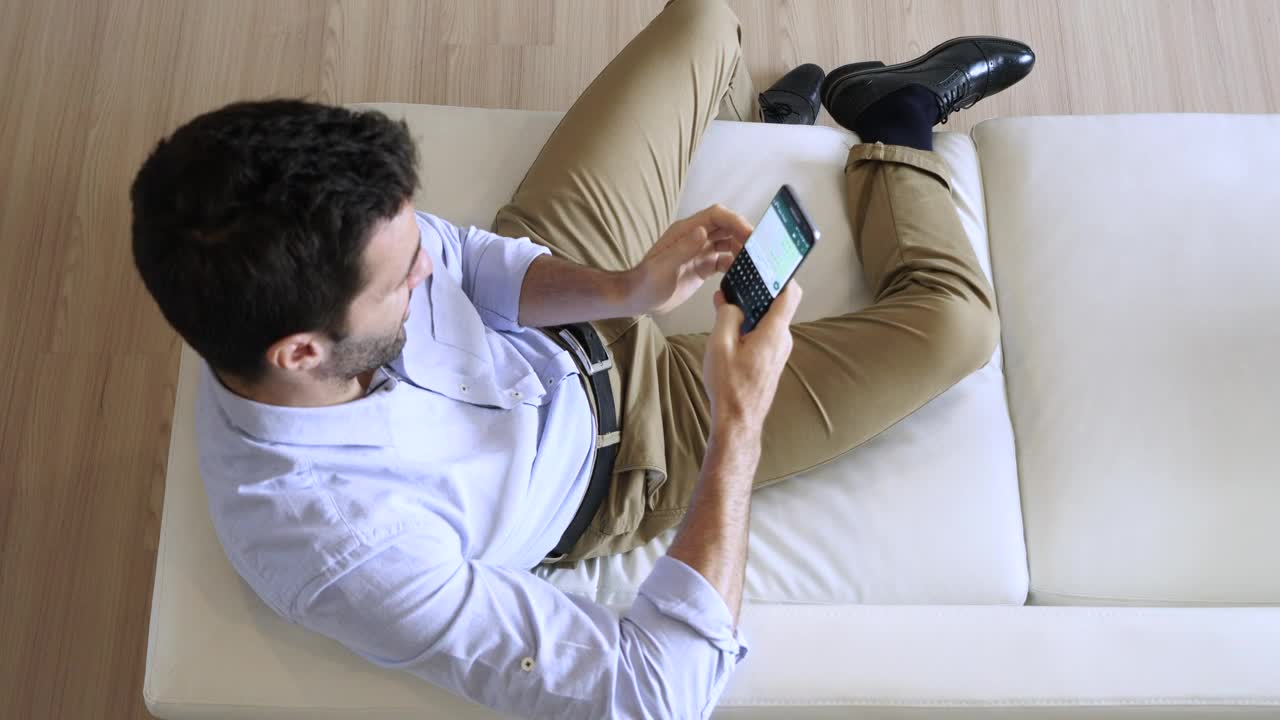 Stock Video Man Sending A Text Message While Relaxin Animated Wallpaper