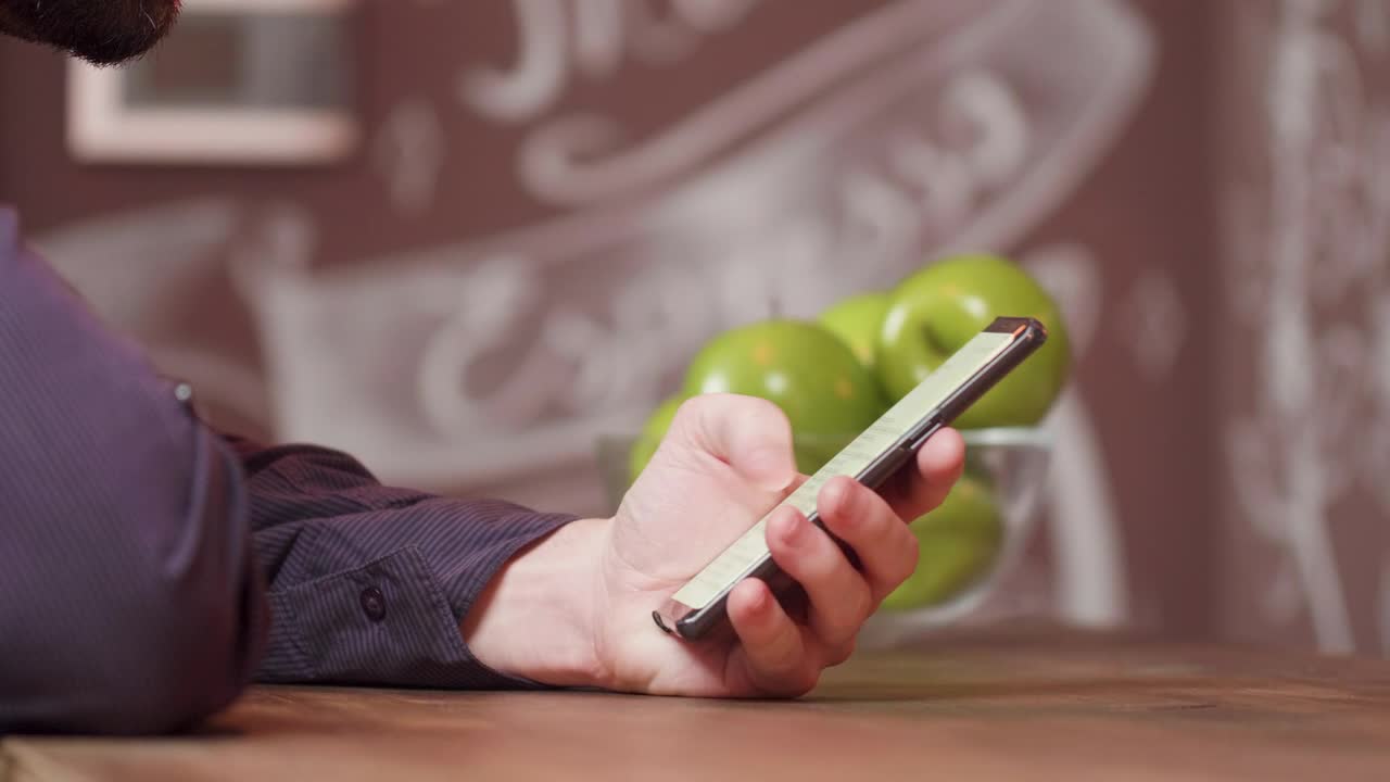 Stock Video Man Scrolling Through His Cellphon Animated Wallpaper