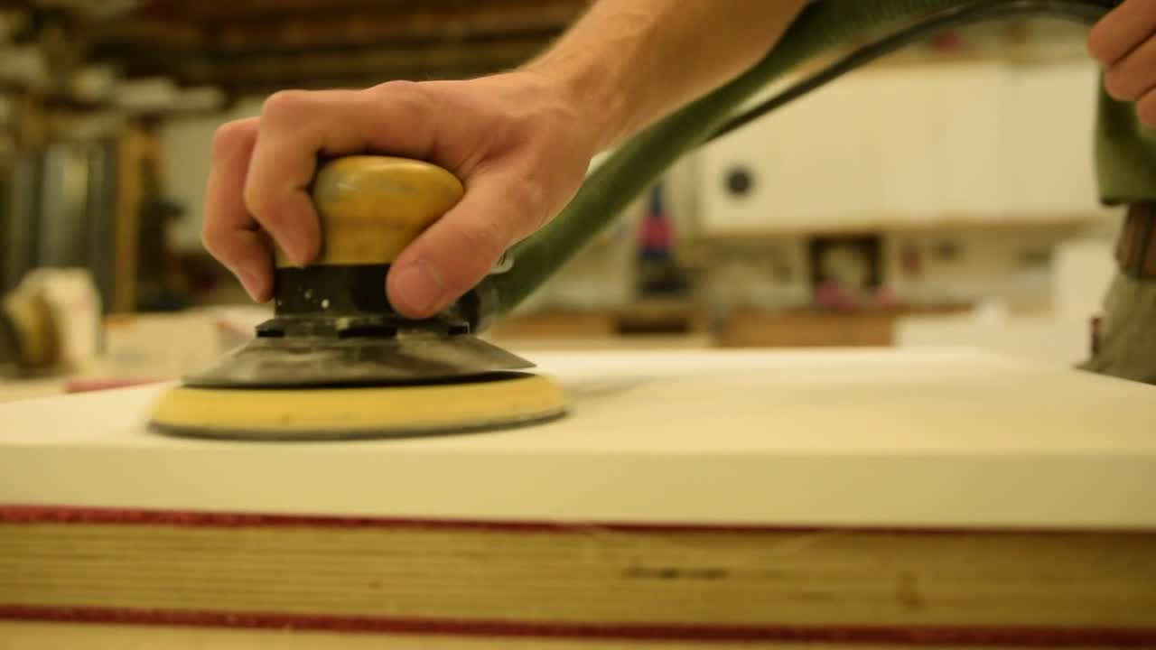 Stock Video Man Sanding A Table With A Sande Animated Wallpaper