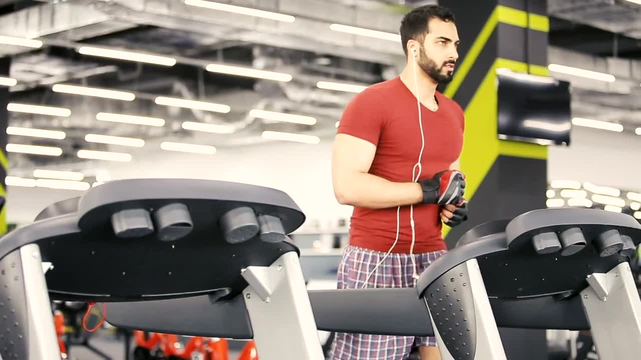 Stock Video Man Runs On Weight Loss Machine In Gy Animated Wallpaper
