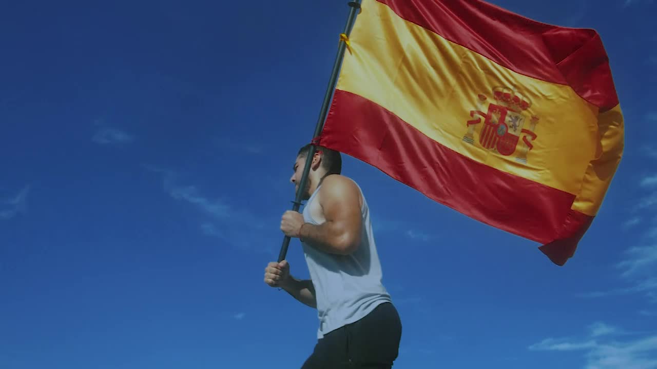 Stock Video Man Running With Spanish Fla Animated Wallpaper