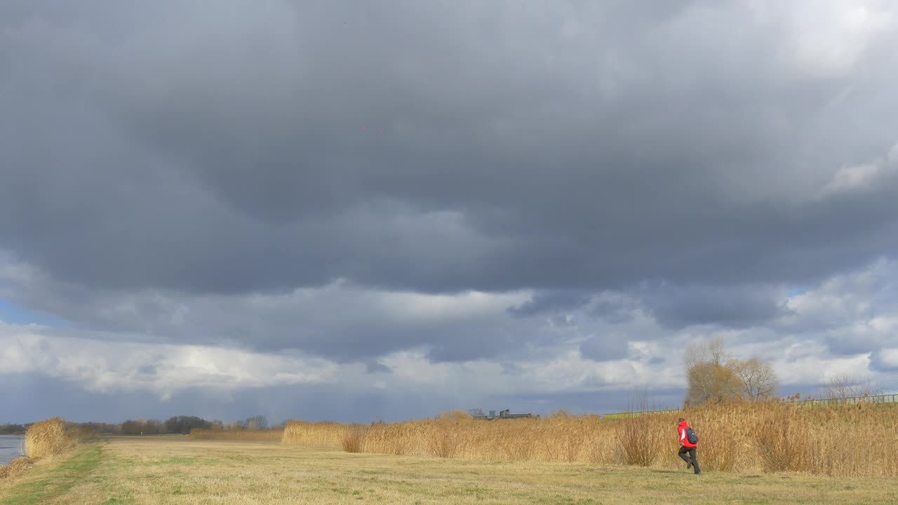 Stock Video Man Running On A Cloudy Da Animated Wallpaper