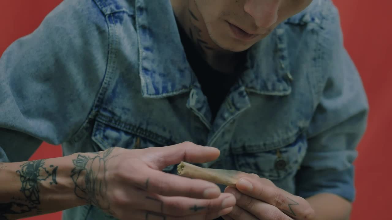 Stock Video Man Rolling Up A Cannabis Join Animated Wallpaper