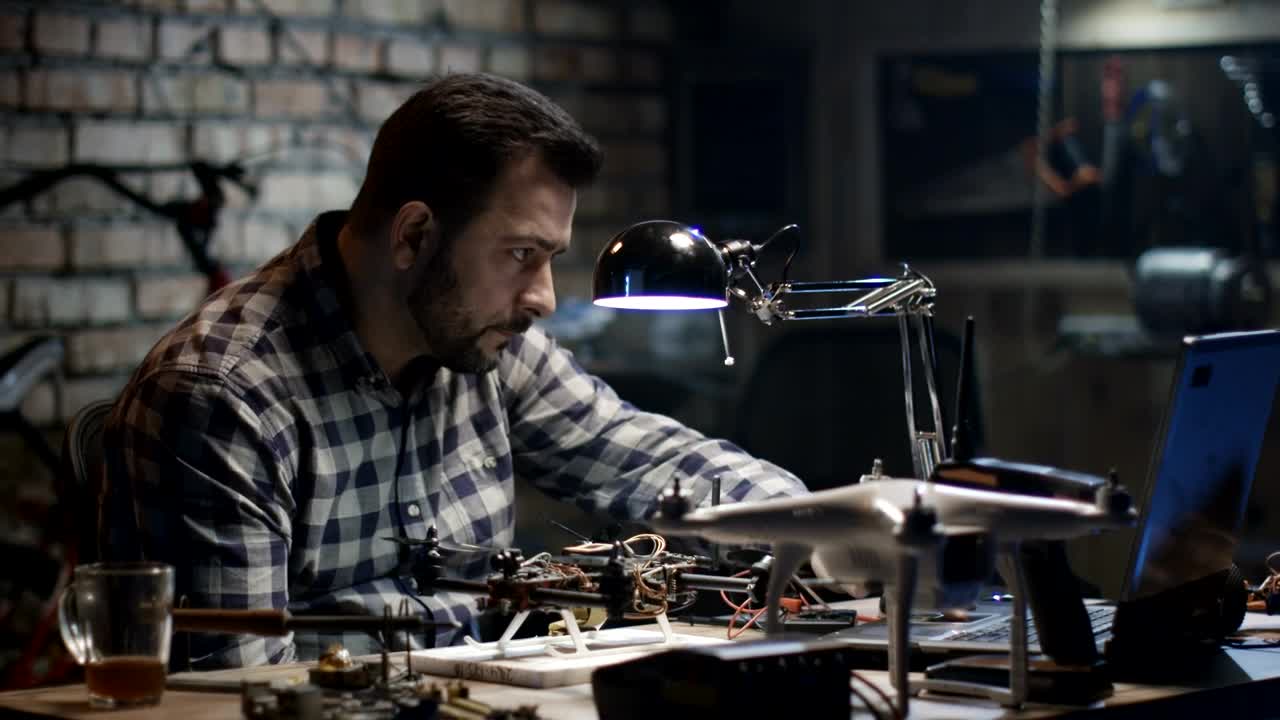 Stock Video Man Repairing A Drone In The Gorg Animated Wallpaper