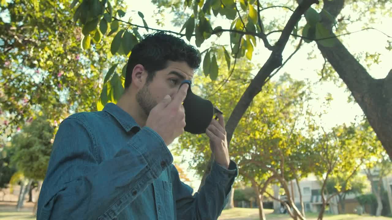 Stock Video Man Putting On A Mas Animated Wallpaper