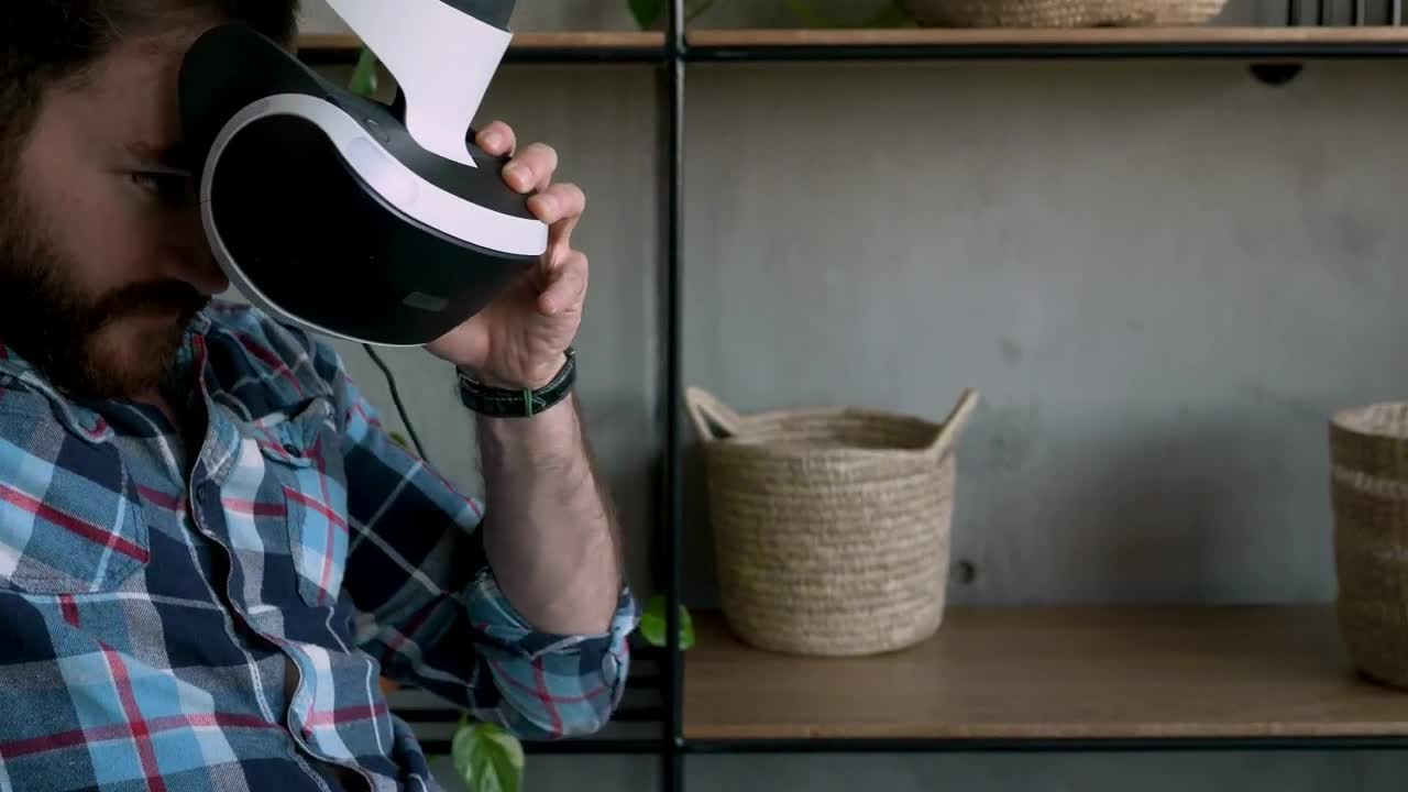 Stock Video Man Puts On Virtual Reality Glasse Animated Wallpaper