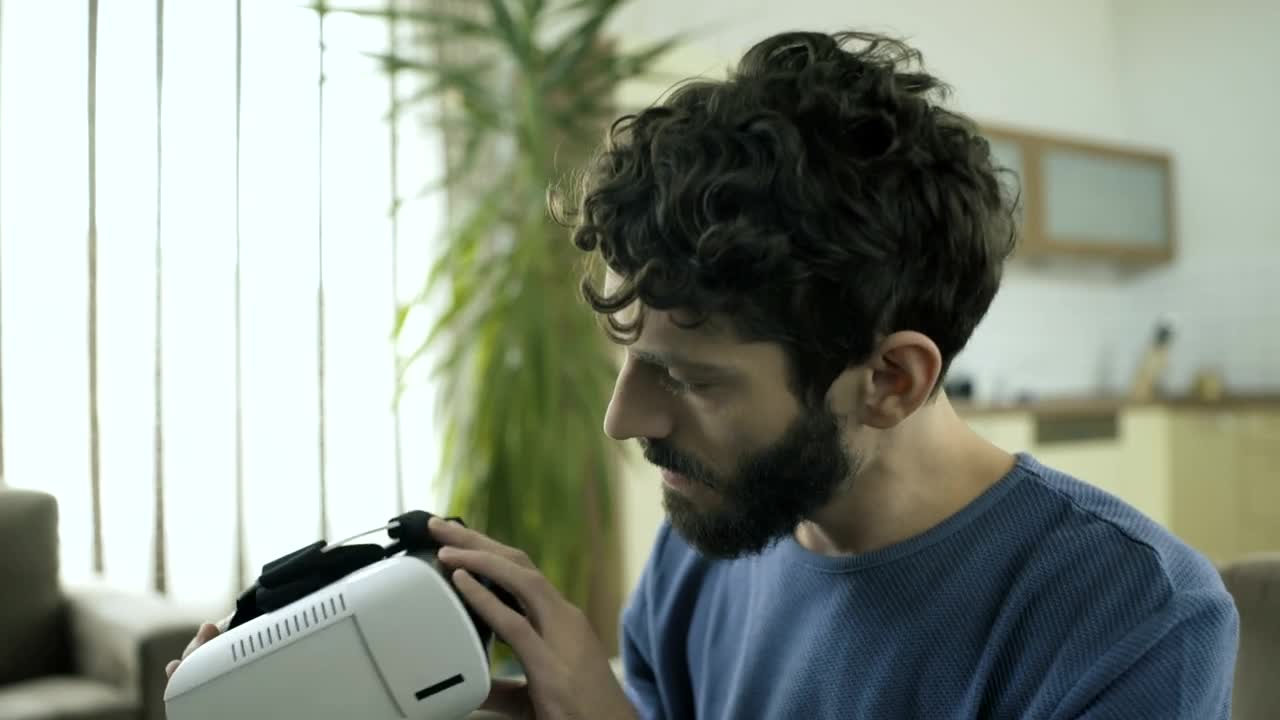 Stock Video Man Puts On A Vr Headse Animated Wallpaper