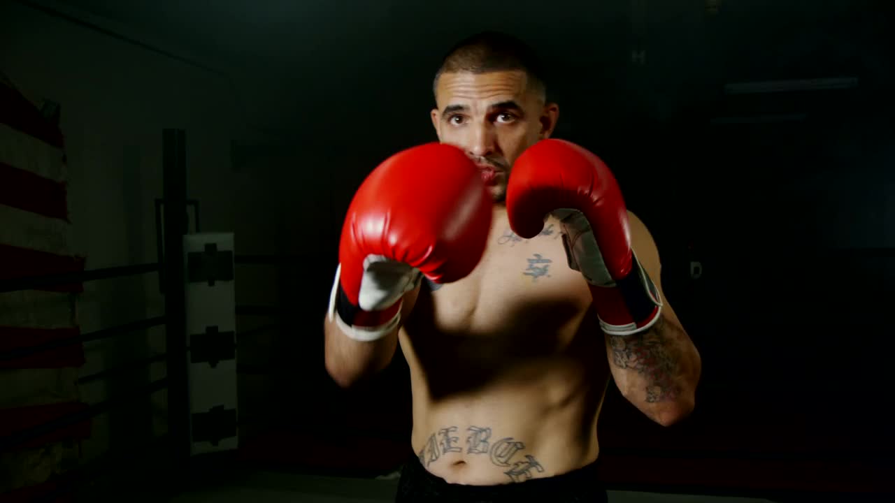 Stock Video Man Punching With Red Boxing Glove Animated Wallpaper