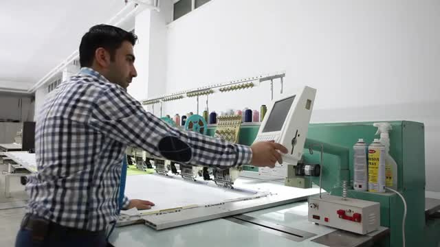 Stock Video Man Programming A Large Industrial Machine Sma Animated Wallpaper