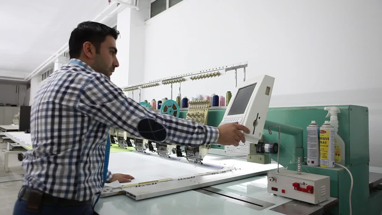 Stock Video Man Programming A Large Industrial Machin Animated Wallpaper