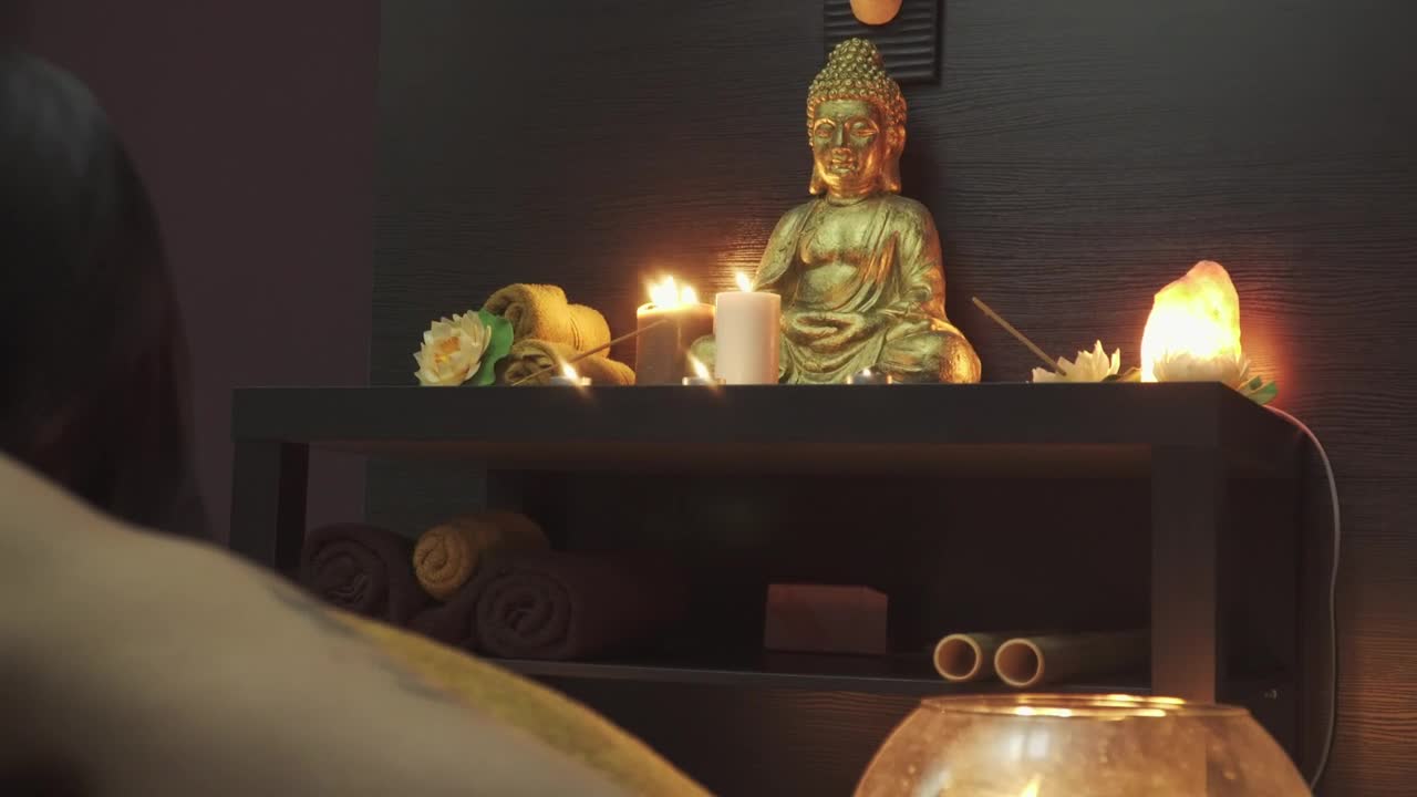 Stock Video Man Praying To Candle Lit Buddh Animated Wallpaper
