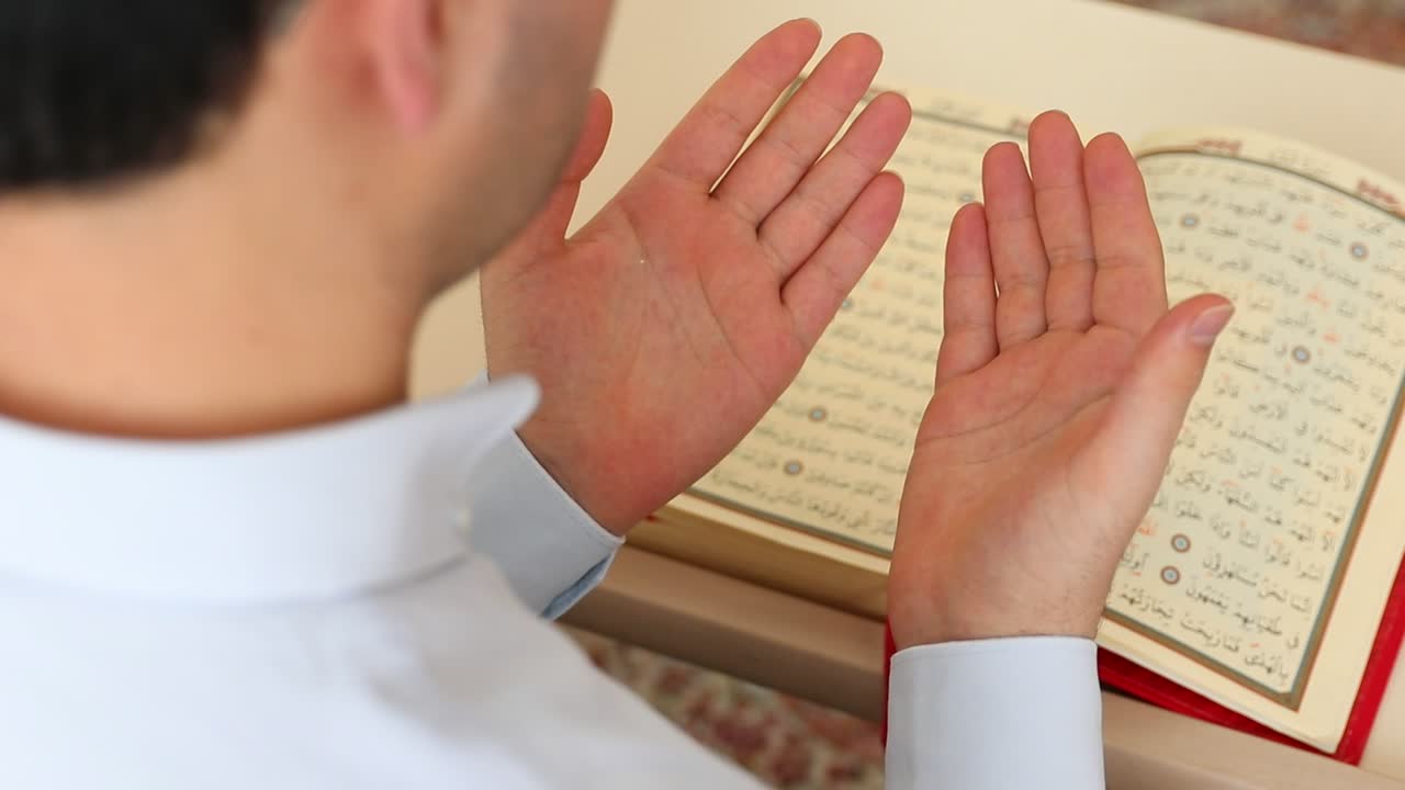 Stock Video Man Praying Before The Qura Animated Wallpaper