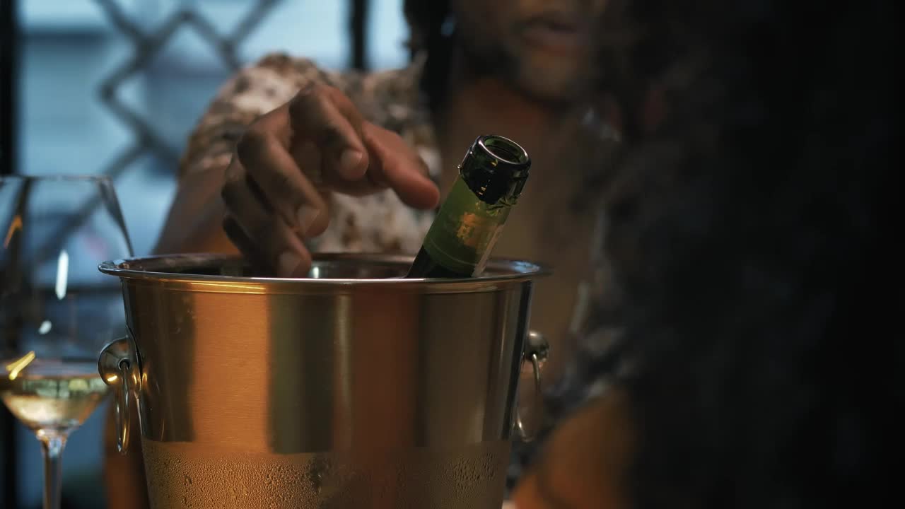 Stock Video Man Pouring Champagne Into His Glass During A Romantic Dat Animated Wallpaper