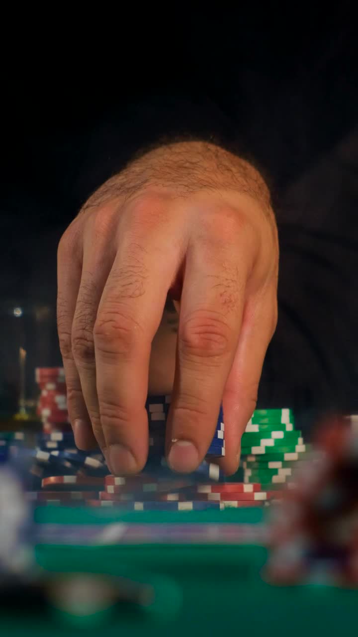Stock Video Man Playing With A Tower Of Poker Chip Animated Wallpaper