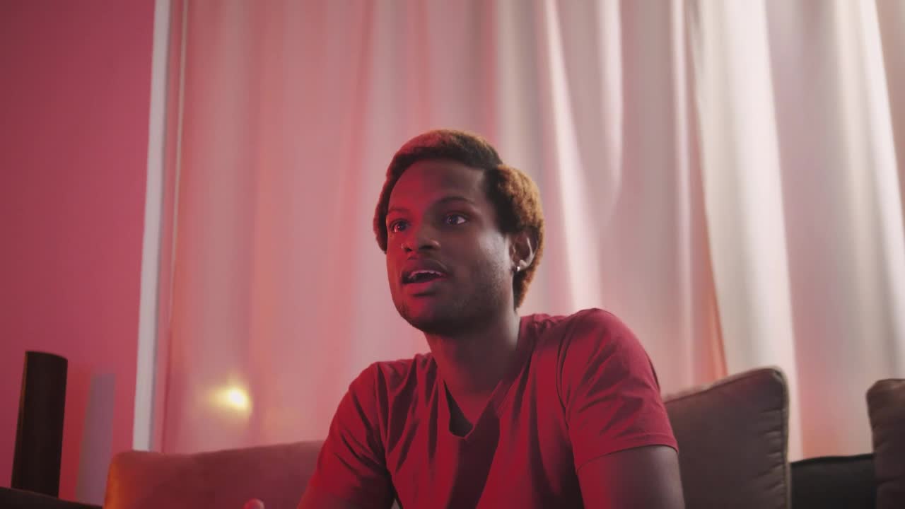 Stock Video Man Playing Video Games In The Living Roo Animated Wallpaper