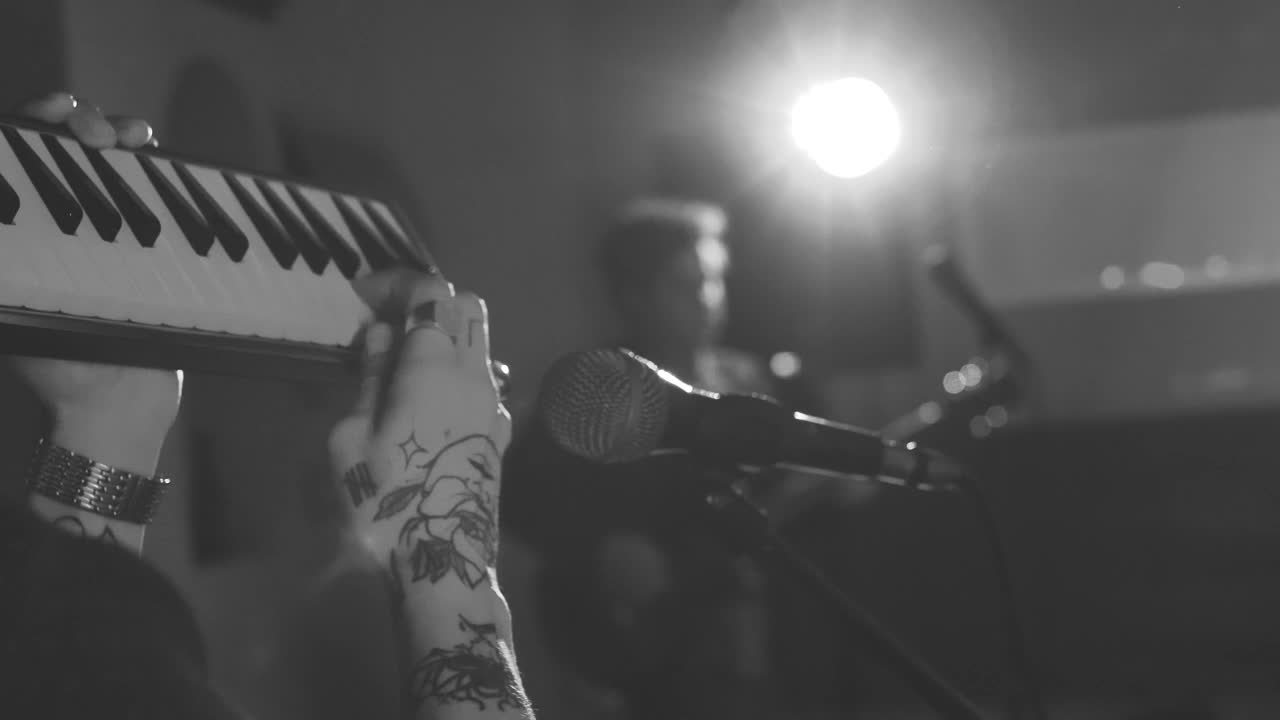 Stock Video Man Playing A Keyboard In Front Of A Microphon Animated Wallpaper