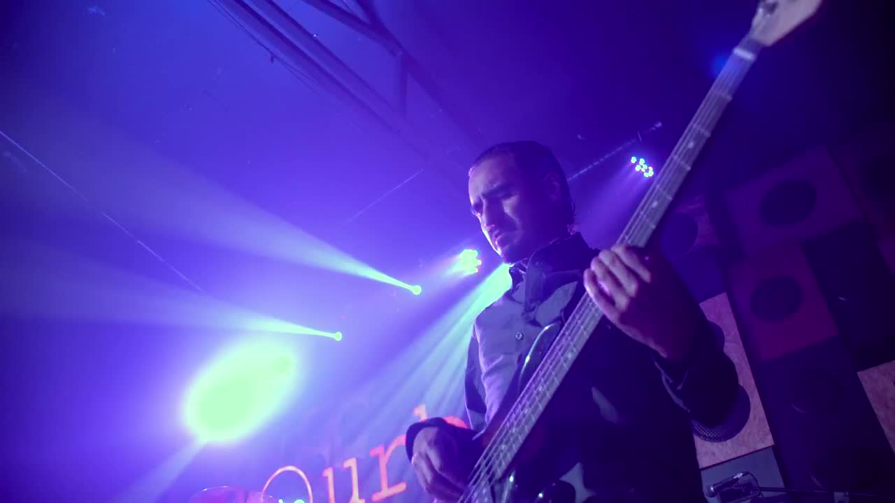 Stock Video Man Playing A Bass Guitar On A Stag Animated Wallpaper