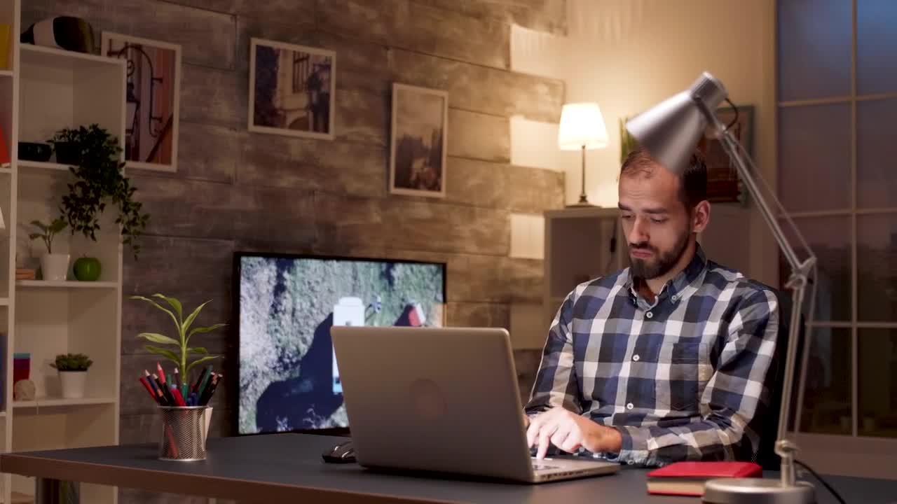 Stock Video Man Pauses To Think While Working On Lapto Animated Wallpaper