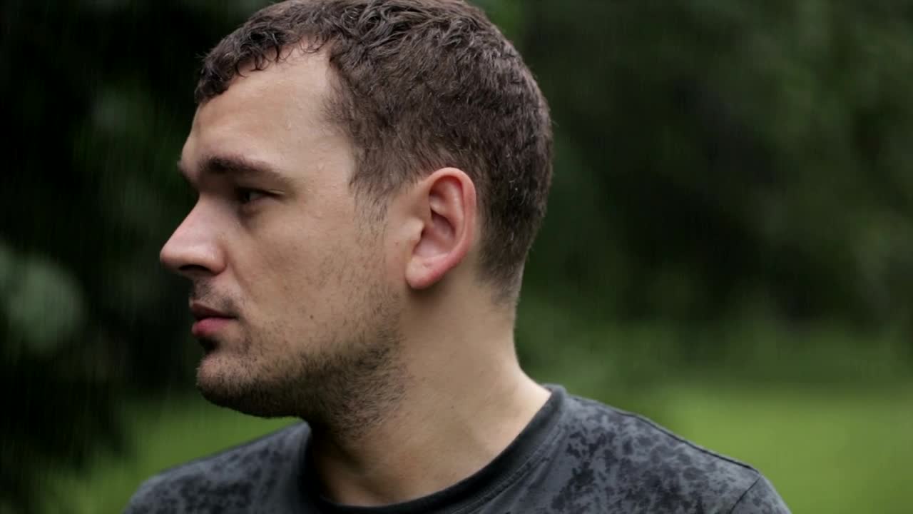 Stock Video Man Outside In The Rai Animated Wallpaper