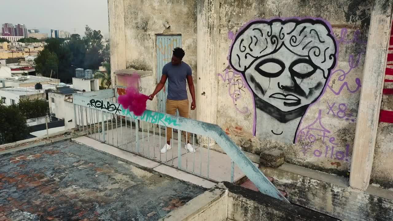 Stock Video Man On Rooftop With Smoke Bom Animated Wallpaper