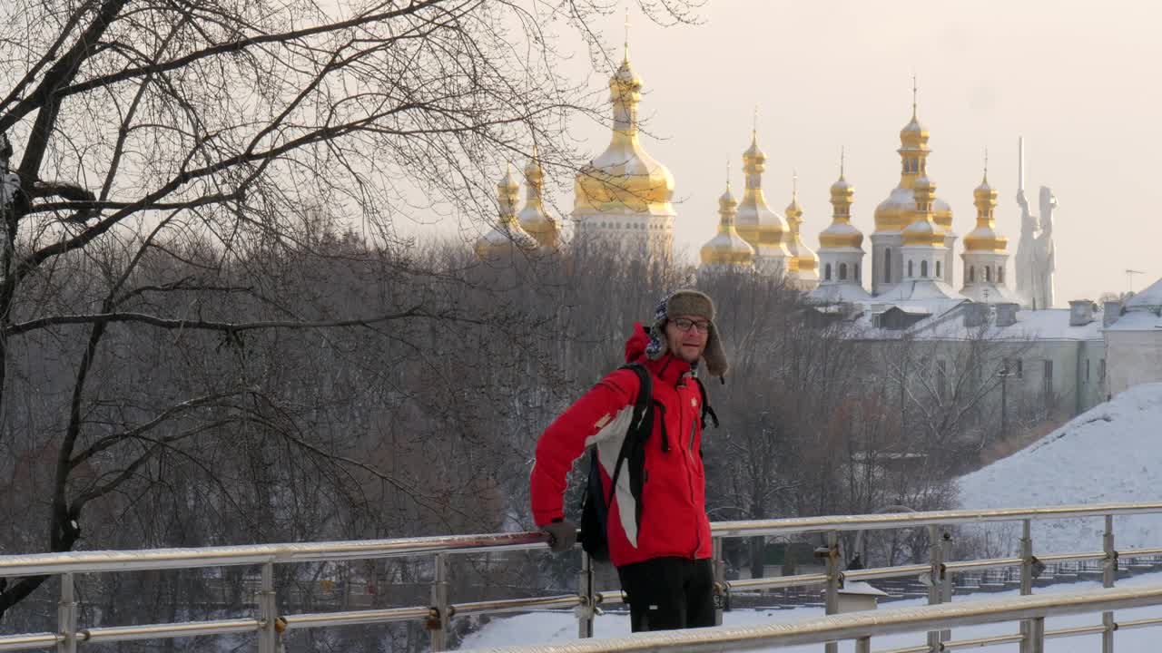Stock Video Man On A Bridge In A Snowy Cit Animated Wallpaper