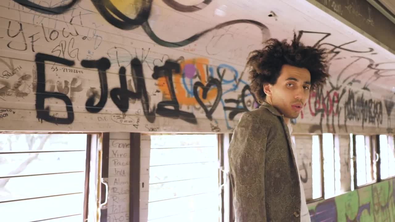 Stock Video Man Modeling In Graffitied Tunne Animated Wallpaper