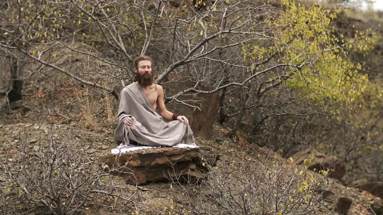 Stock Video Man Meditating On The Mountai Animated Wallpaper