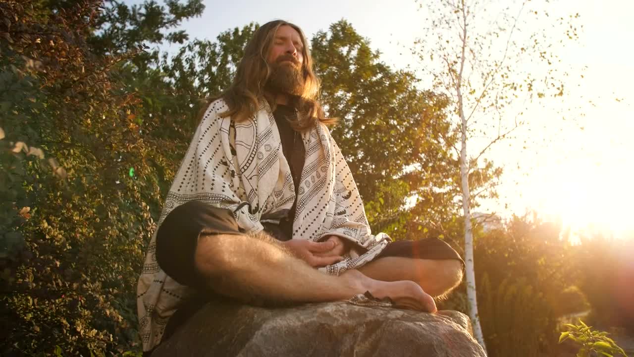 Stock Video Man Meditating Deeply At Sunset In Natur Animated Wallpaper