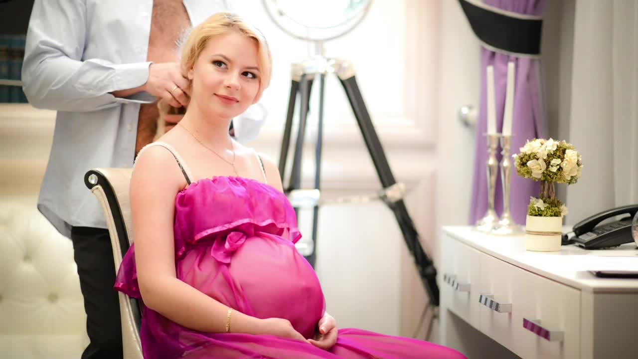 Stock Video Man Massages The Neck Of His Pregnant Wif Animated Wallpaper