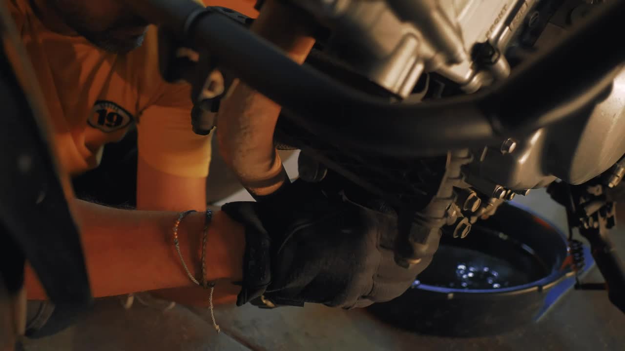 Stock Video Man Maintaining A Motorcycl Animated Wallpaper