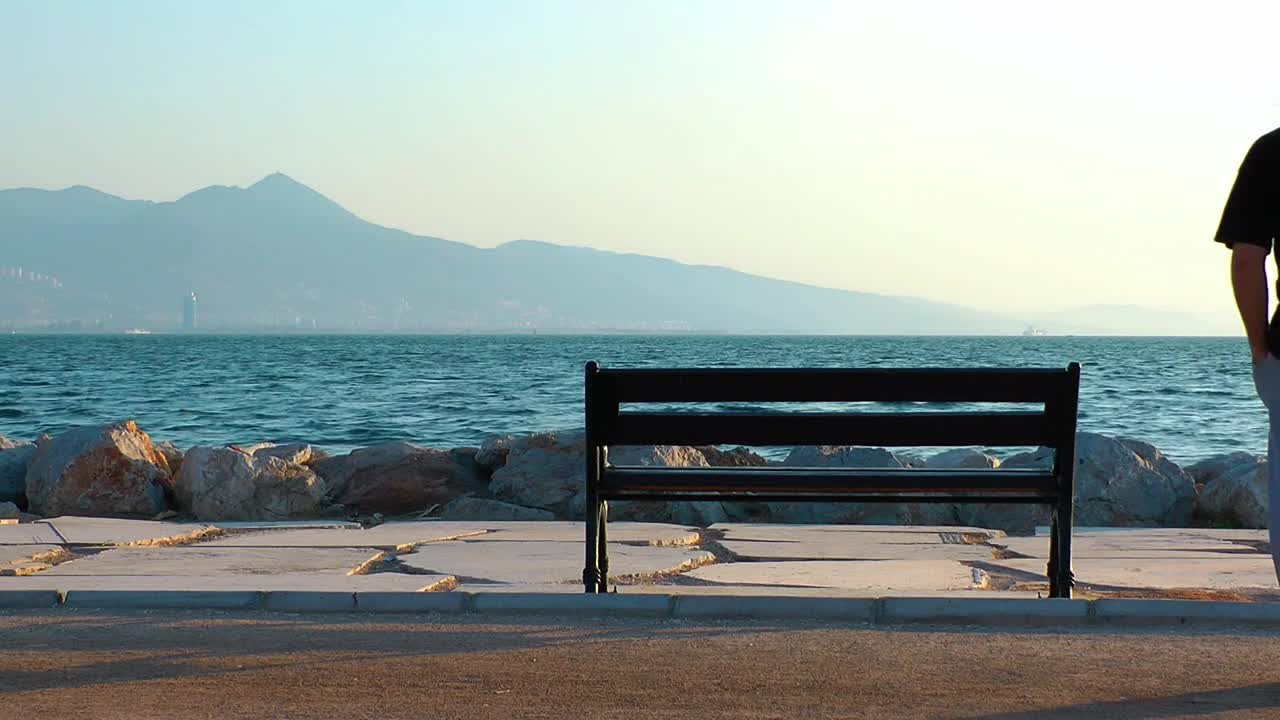 Stock Video Man Looking Out To Sea At The Pier From Animated Wallpaper